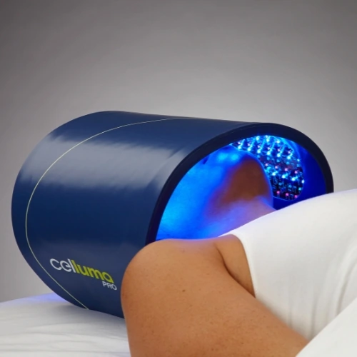 A Celluma PRO LED panel glowing blue over a client